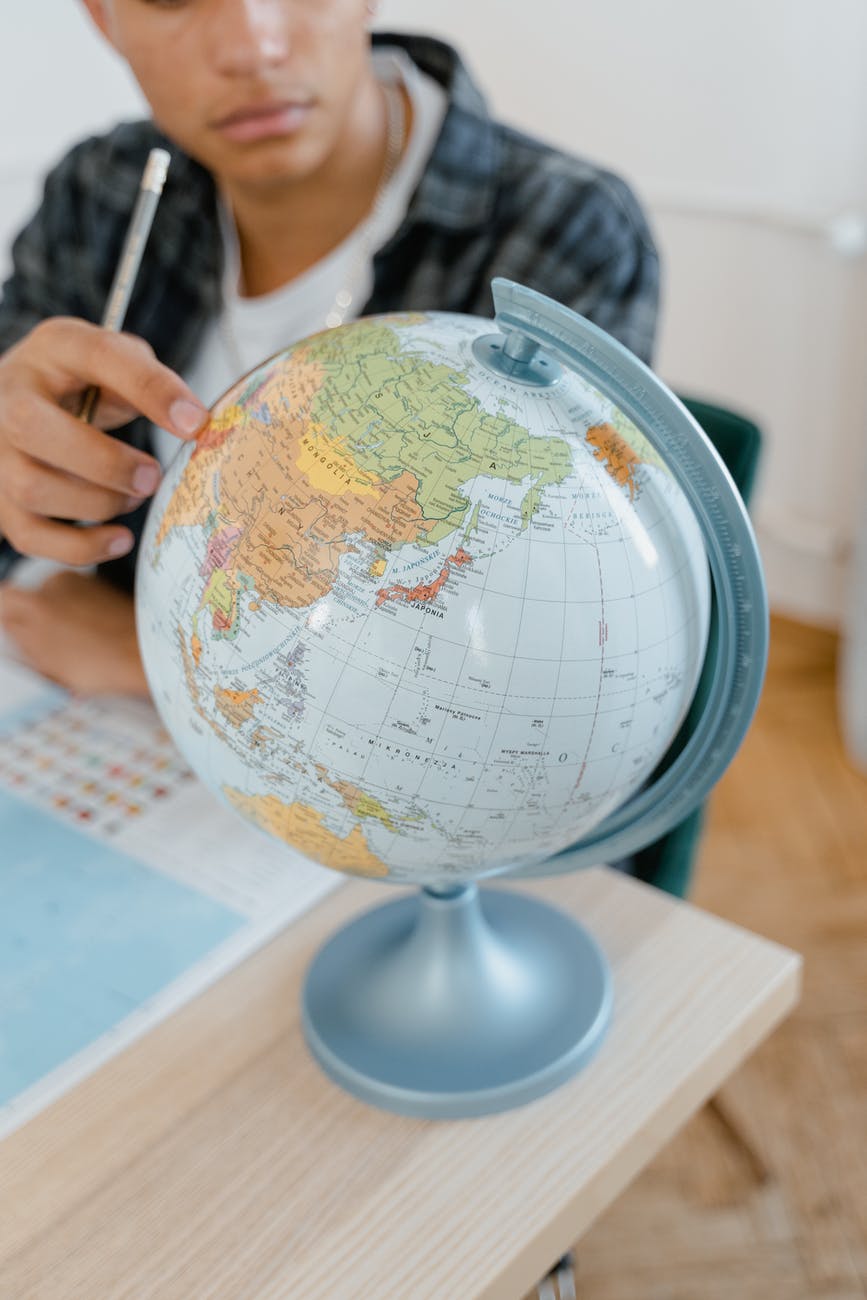 close up photo of a student studying the world map