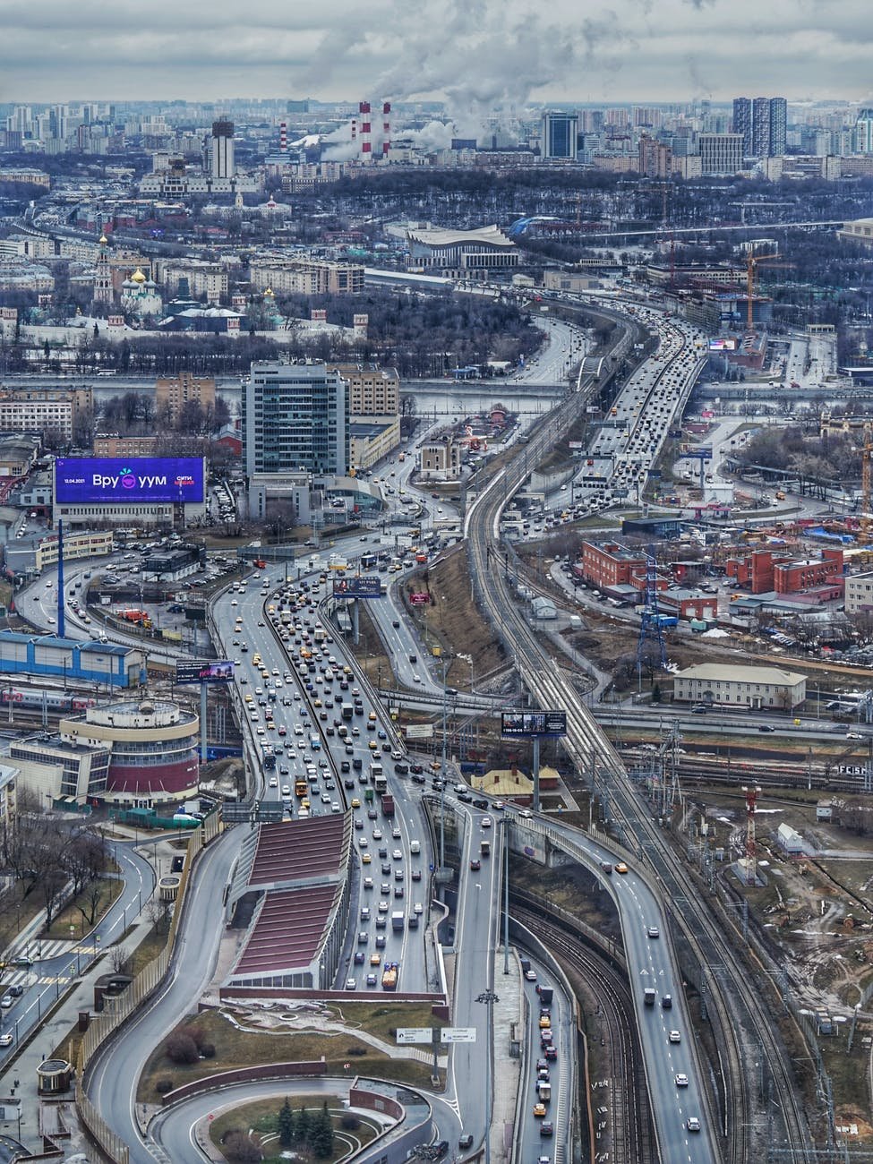 an aerial shot of a highway in a city