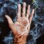 photo of person s hand submerged in water