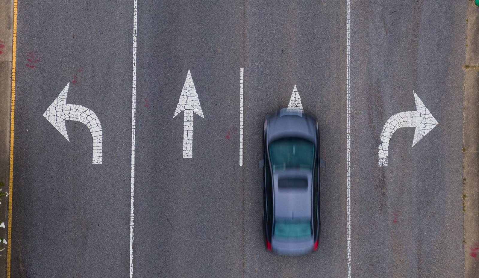 grey sedan on the road