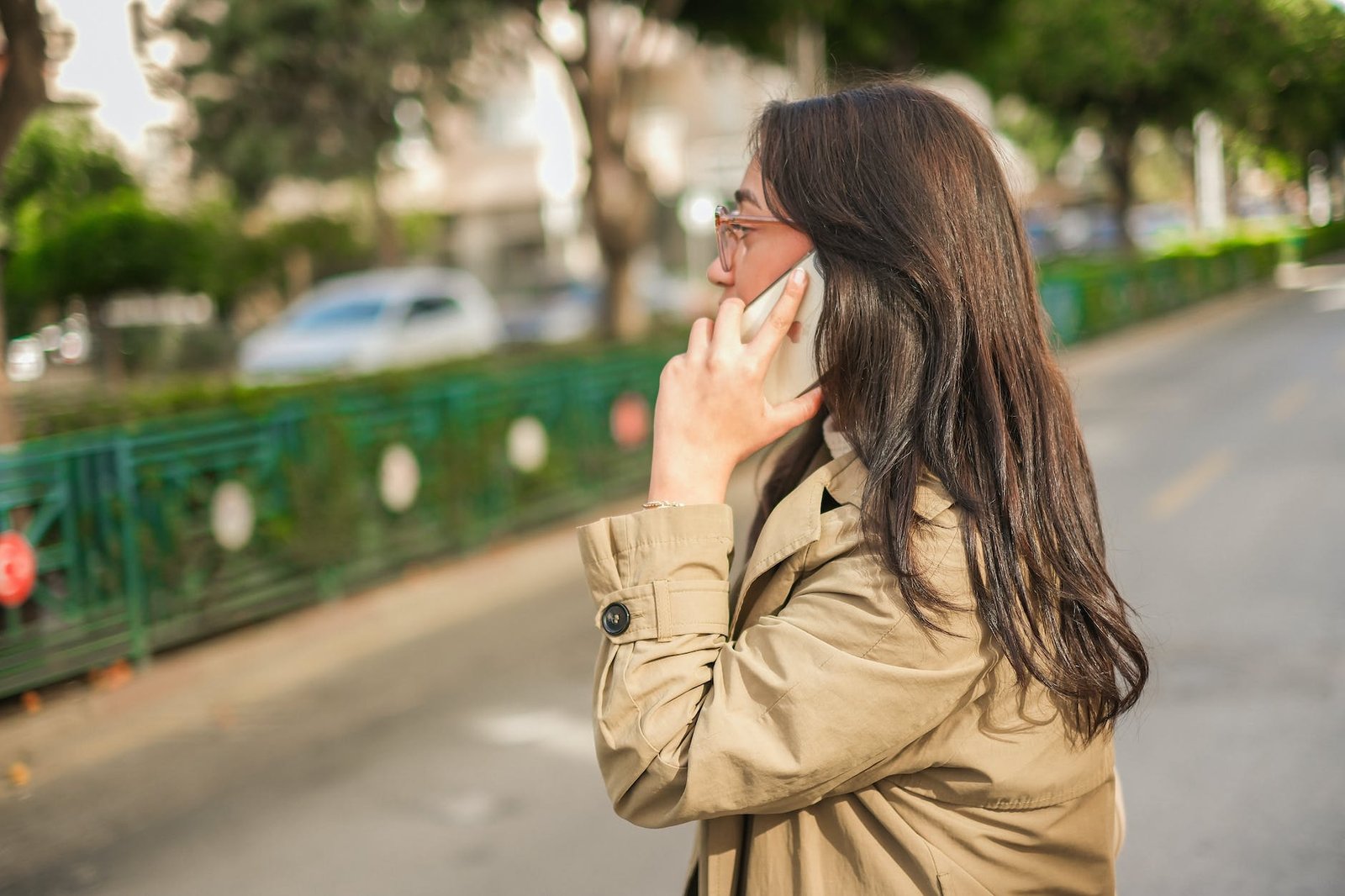 woman talking on a phone on a street